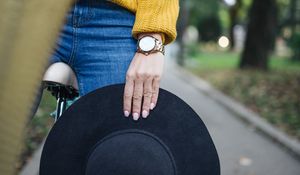 Preview wallpaper girl, hand, hat, bike