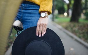 Preview wallpaper girl, hand, hat, bike