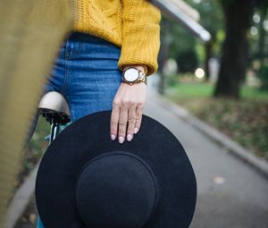 Preview wallpaper girl, hand, hat, bike