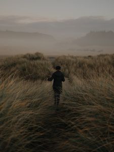 Preview wallpaper girl, hat, grass, fog