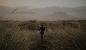 Preview wallpaper girl, hat, grass, fog
