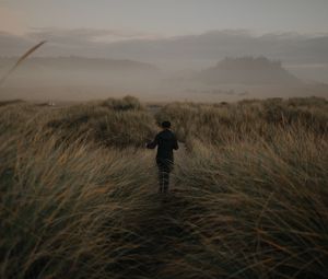 Preview wallpaper girl, hat, grass, fog
