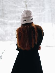 Preview wallpaper girl, hat, hair, snow, winter
