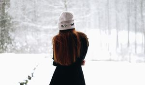 Preview wallpaper girl, hat, hair, snow, winter