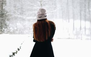Preview wallpaper girl, hat, hair, snow, winter