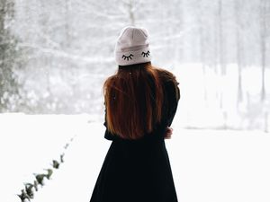 Preview wallpaper girl, hat, hair, snow, winter