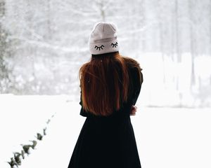 Preview wallpaper girl, hat, hair, snow, winter