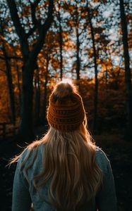 Preview wallpaper girl, hat, hair, forest, rays
