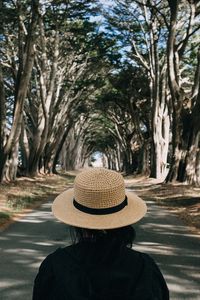 Preview wallpaper girl, hat, road, trees, aesthetics