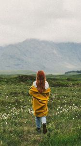 Preview wallpaper girl, lawn, mountains, fog, nature