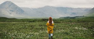 Preview wallpaper girl, lawn, mountains, fog, nature