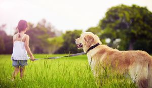 Preview wallpaper girl, leash, dog, walk, grass, park