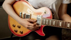 Preview wallpaper girl, legs, guitar, music