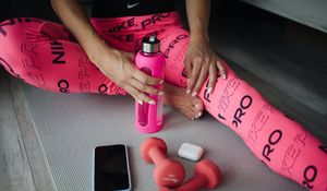 Preview wallpaper girl, bottle, dumbbells, fitness, sport, pink