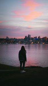 Preview wallpaper girl, loneliness, alone, city, sunset, water