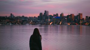 Preview wallpaper girl, loneliness, alone, city, sunset, water