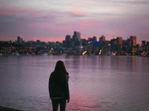 Preview wallpaper girl, loneliness, alone, city, sunset, water