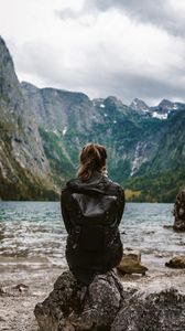 Preview wallpaper girl, loneliness, alone, rocks, lake