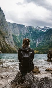 Preview wallpaper girl, loneliness, alone, rocks, lake