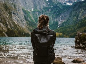 Preview wallpaper girl, loneliness, alone, rocks, lake