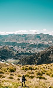 Preview wallpaper girl, mountains, grass, travel, tourist, queenstown, new zealand