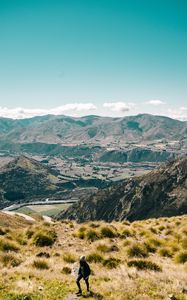 Preview wallpaper girl, mountains, grass, travel, tourist, queenstown, new zealand