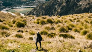 Preview wallpaper girl, mountains, grass, travel, tourist, queenstown, new zealand