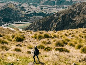 Preview wallpaper girl, mountains, grass, travel, tourist, queenstown, new zealand