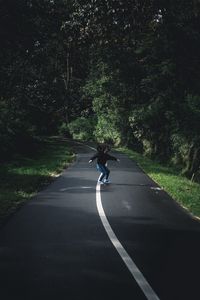 Preview wallpaper girl, movement, road, marking, trees