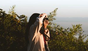 Preview wallpaper girl, photographer, camera, bushes