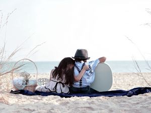 Preview wallpaper girl, sand, trash, grass, couple, date