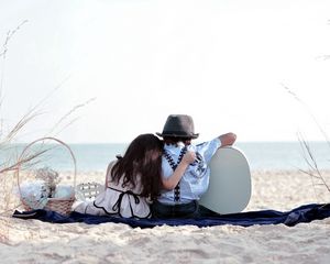 Preview wallpaper girl, sand, trash, grass, couple, date