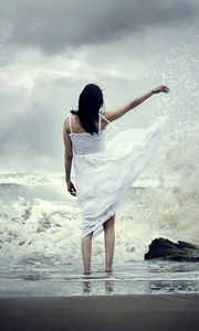 Preview wallpaper girl, sea, surf, dress, spray