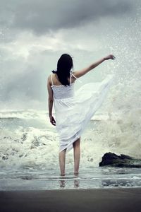 Preview wallpaper girl, sea, surf, dress, spray