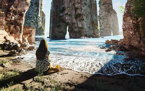 Preview wallpaper girl, shore, sea, rocks, alone, art