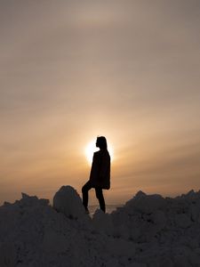 Preview wallpaper girl, silhouette, alone, stones, sunset, sun, dark