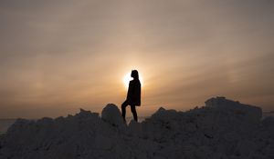 Preview wallpaper girl, silhouette, alone, stones, sunset, sun, dark