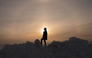 Preview wallpaper girl, silhouette, alone, stones, sunset, sun, dark