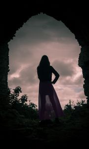Preview wallpaper girl, silhouette, cave, twilight, dark