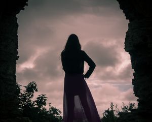 Preview wallpaper girl, silhouette, cave, twilight, dark