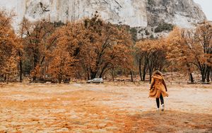 Preview wallpaper girl, silhouette, rock, trees, mountain