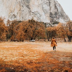 Preview wallpaper girl, silhouette, rock, trees, mountain