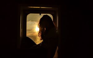 Preview wallpaper girl, silhouette, window, sunset, sun, light, dark