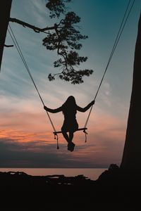 Preview wallpaper girl, swing, silhouette, branch, sunset