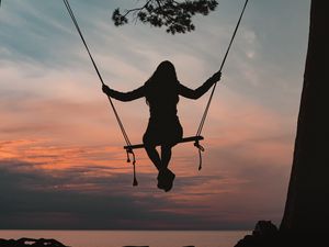 Preview wallpaper girl, swing, silhouette, branch, sunset