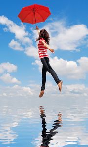 Preview wallpaper girl, water, flying, umbrella, mood