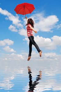 Preview wallpaper girl, water, flying, umbrella, mood