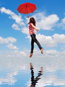 Preview wallpaper girl, water, flying, umbrella, mood