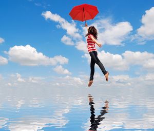 Preview wallpaper girl, water, flying, umbrella, mood