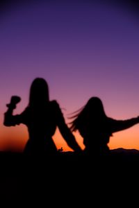 Preview wallpaper girls, silhouettes, dance, twilight, dark